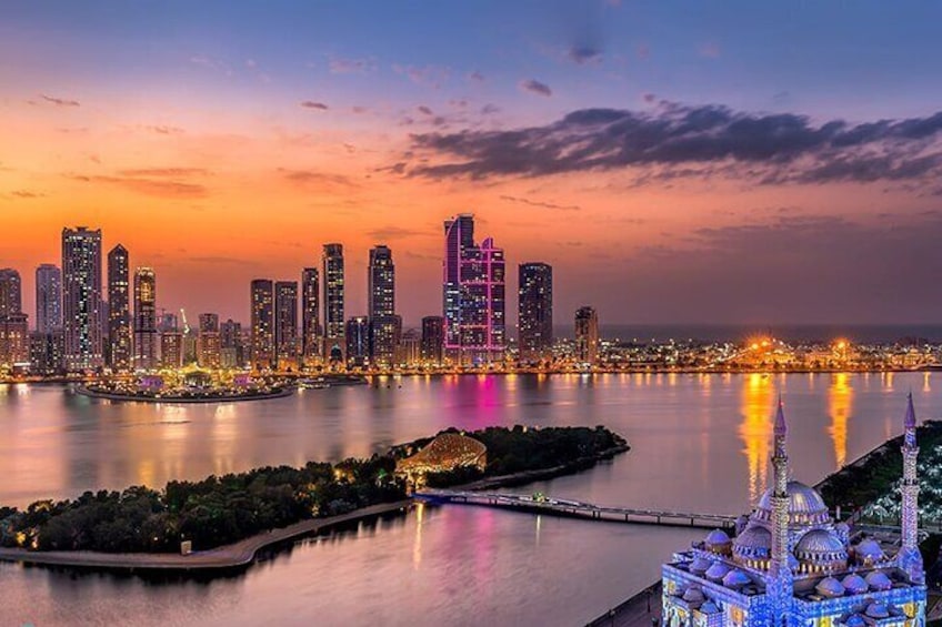 A breathtaking view of Sharjah’s skyline as seen from Al Noor Island at sunset.