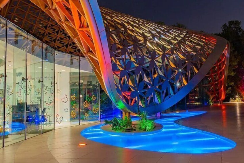 Al Noor Island illuminated at night, creating a magical ambiance for visitors.
