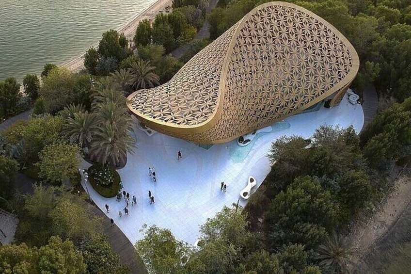 Al Noor Island’s unique architectural design surrounded by lush greenery.