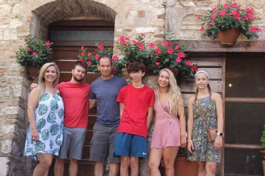 A beautiful family from California enjoying the day during the city walk in Assisi and Spello , enjoying the photo shoot organized in the city of Assisi