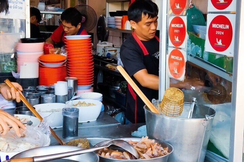 Taste iconic Michelin dishes such as Thana Ocha's Hakka-style pink noodle (Yen Ta Fo), a 5-years MICHELIN Bib Gourmand awarded dish
