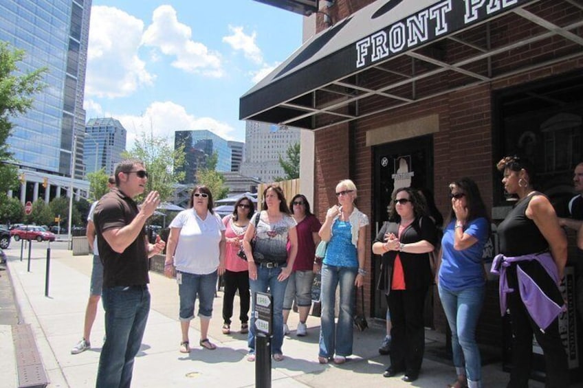 Guide presenting to group on Mass Avenue