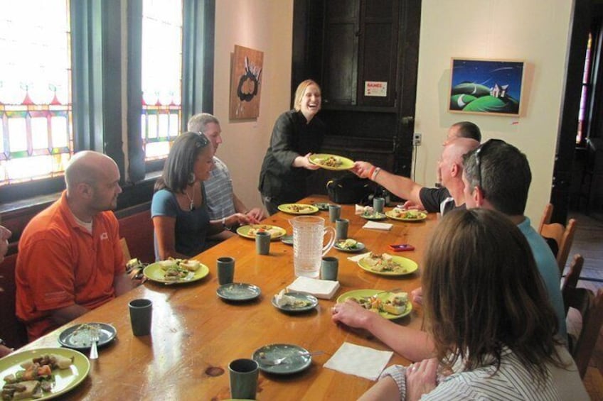 In a restaurant on tour speaking to a chef