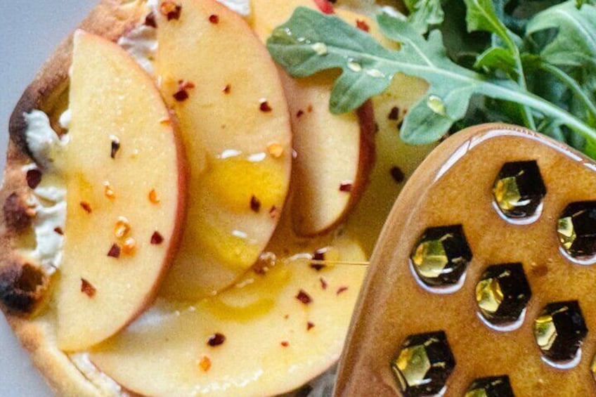 Hawaiian honey being drizzled on delicious nibbles