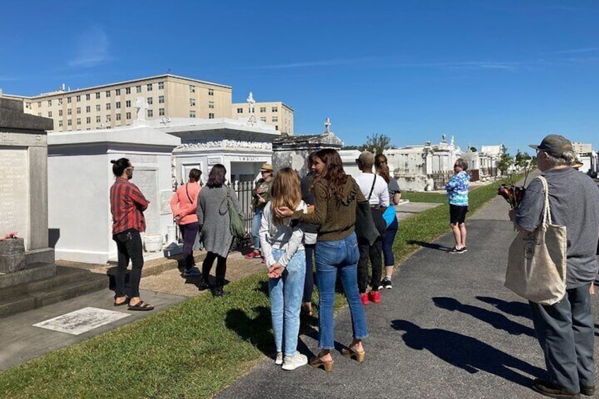 Visitors learn the mysteries of New Orleans' cemeteries.