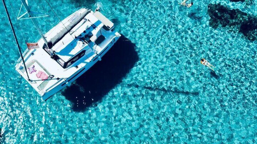 Stintino Half Day Catamaran Tour to La Pelosa with Aperitif