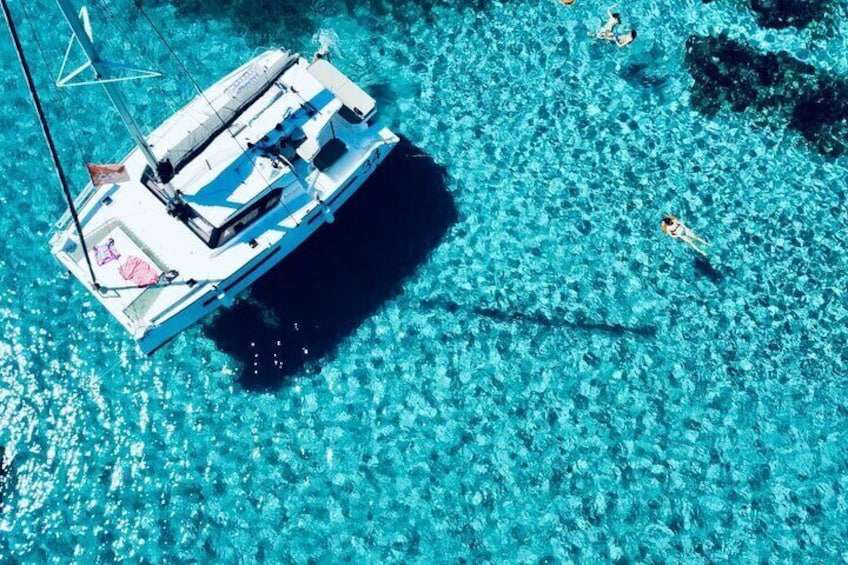 Stintino Half Day Catamaran Tour to La Pelosa with Aperitif