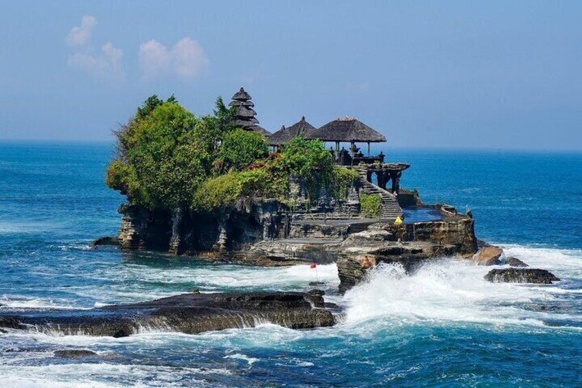 Tanah Lot in Tabanan: A famous sea temple perched on a rocky outcrop, known for its breathtaking ocean views, especially during sunset.