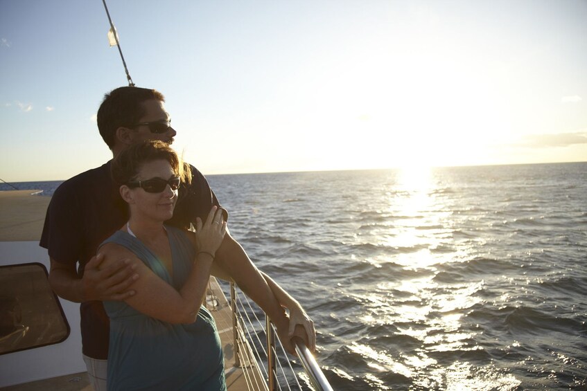 Couple enjoying the views on the Waikiki Sunset Cocktail Cruise