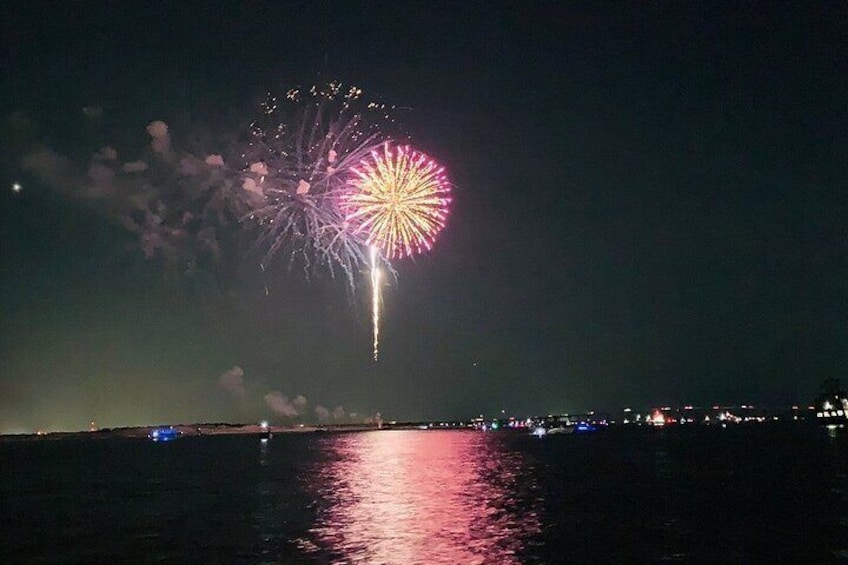 Destin Harbor Fireworks show viewed from SunVenture catamaran. 