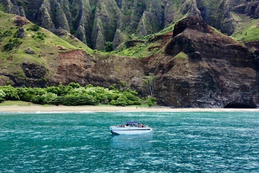 Our Deluxe Power Catamaran outside the famous Kalalau Cathedral.