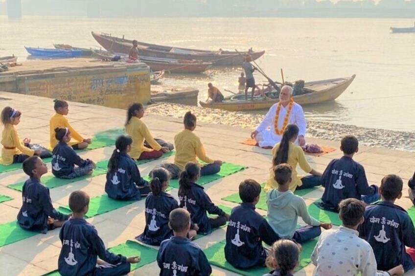 Sunrise yoga on ghat of river Ganga.