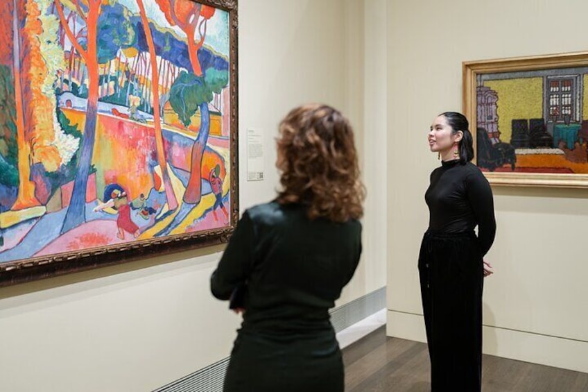 patrons enjoying Impressionist works within the Audrey Jones Beck Building