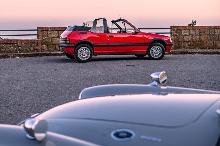 Cefalù and surroundings on a vintage car with hair in the wind