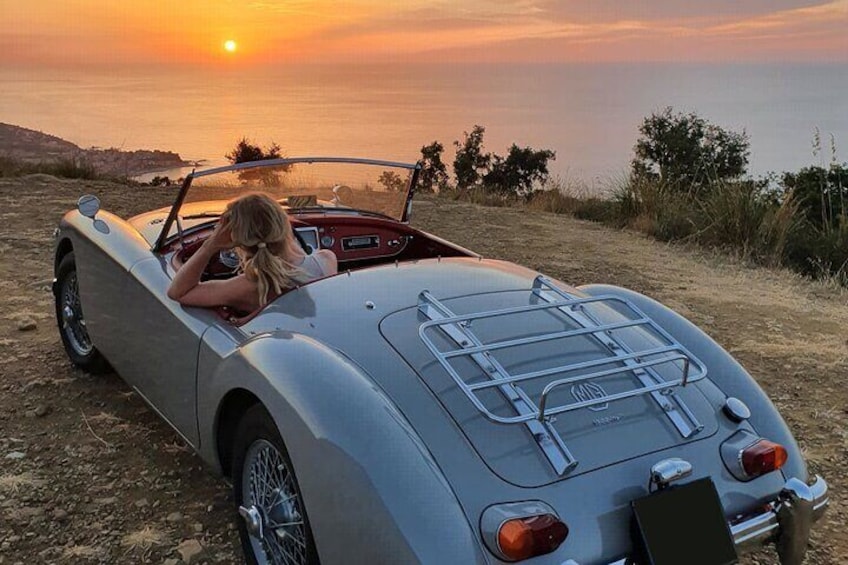 Cefalù and surroundings on a vintage car with hair in the wind