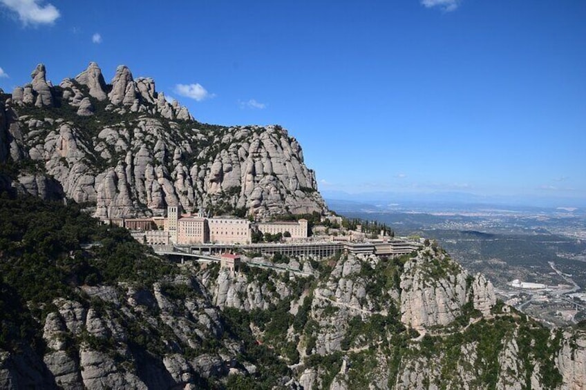 The monastery and mountain of Montserrat seen from the St. Miquel cross