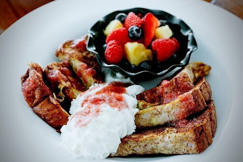 Island Fresh Sweet Taro Bread French Toast - Topped w/ homemade Lilikoi/Strawberry Syrup w/ side of Fresh Mix Fruits Bowl