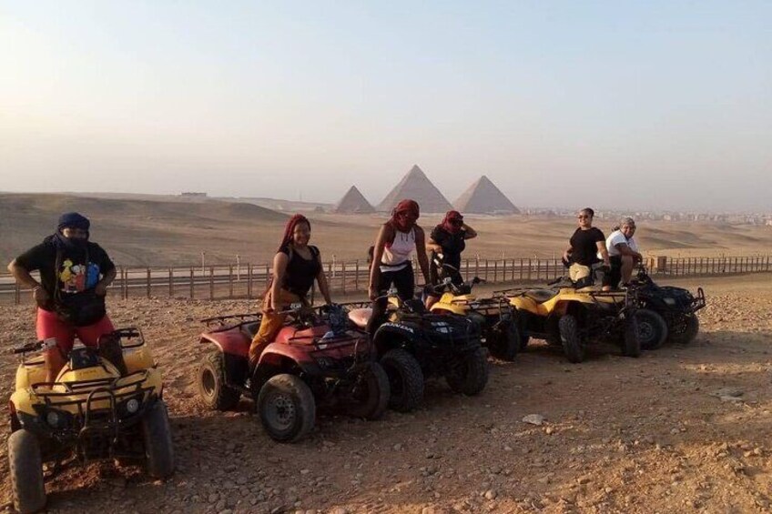 Ride through the majestic desert dunes on a high-speed ATV, just steps away from the Great Pyramids of Giza.