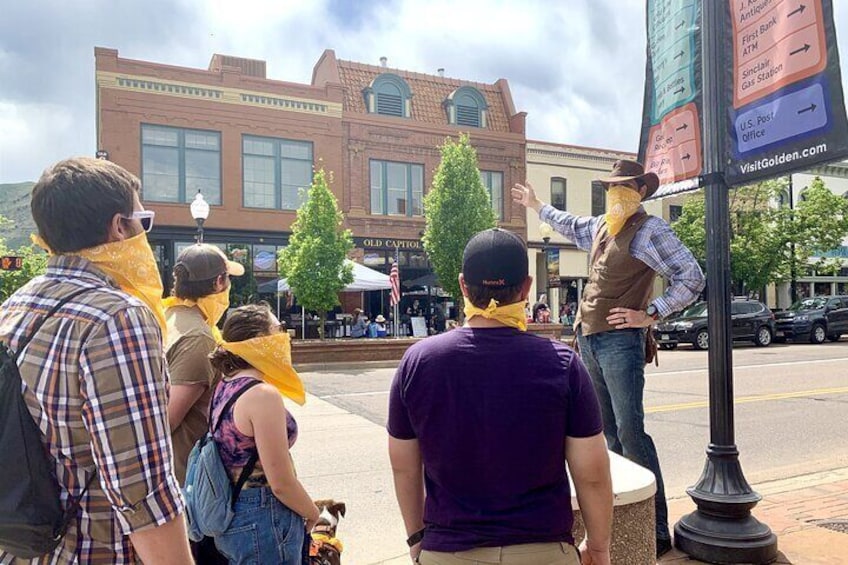 Tour guide leading a tour through historic downtown Golden.