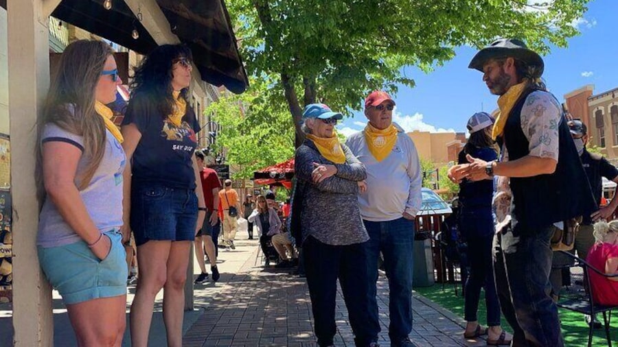 Tour guide telling a story on Washington Ave.