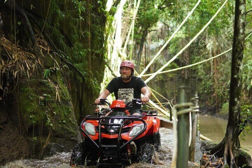 Bali ATV ride through river, tunnel, waterfall, cave and jungle