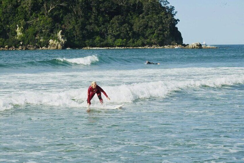 Staying low, navigating the whitewater at Mussel Rock (Mount Maunganui).