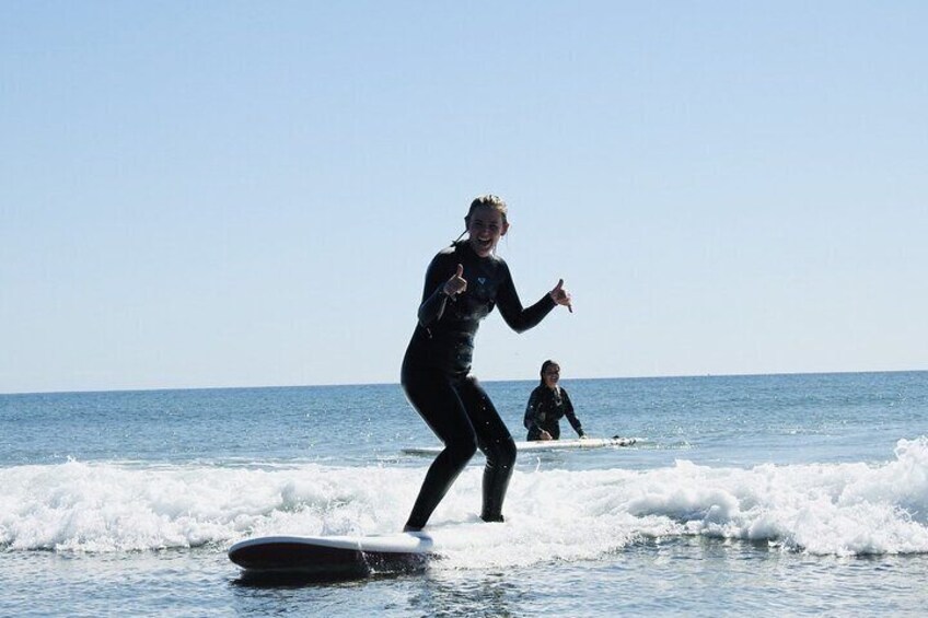 Standing up surfing for the first time. 