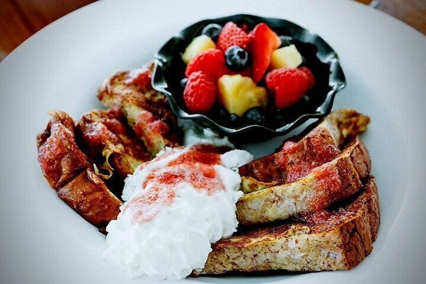 Island Fresh Sweet Taro Bread French Toast - Topped w/ homemade Lilikoi/Strawberry Syrup w/ side of Fresh Mix Fruits Bowl