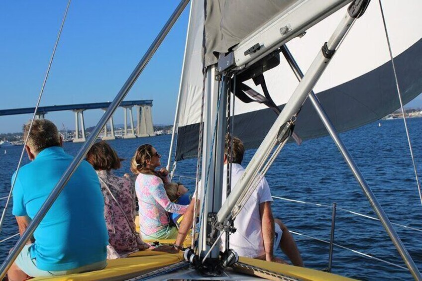 The whole family enjoying the view of the Coronado Bridge out sailing in San diego