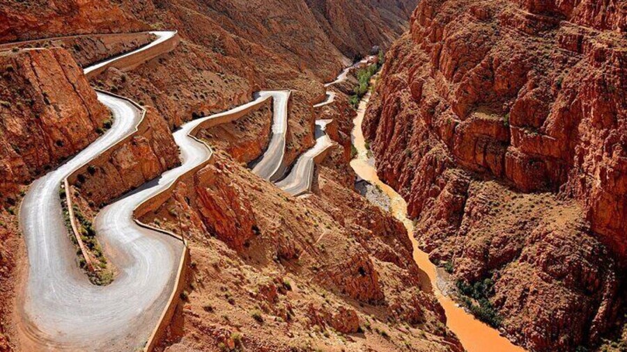 The Dades Gorges are a natural wonder carved by the Dades River, featuring dramatic red cliffs, winding roads, and unique rock formations like the famous “Monkey Fingers.