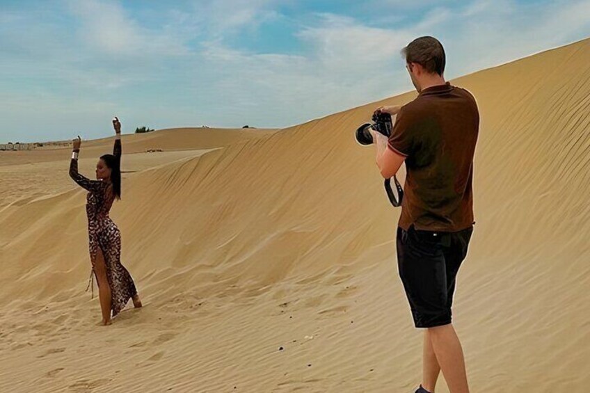 Professional photoshoot session on the stunning red dunes of Dubai