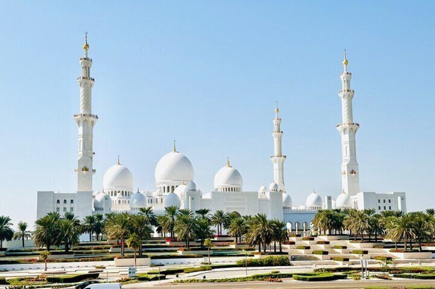 The Sheikh Zayed Grand Mosque in Abu Dhabi is a stunning architectural masterpiece, known for its magnificent domes, intricate marble work, and one of the world’s largest chandeliers. It symbolizes cu