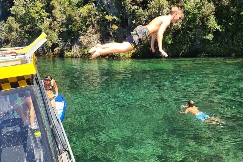 Swimming and paddle boarding inTe Papa Bay