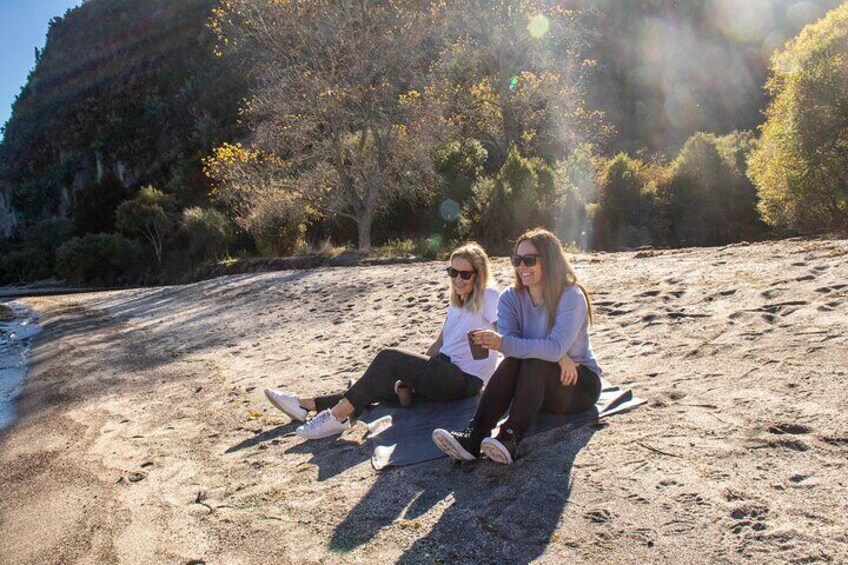 Enjoying fresh, locally roasted coffee on a secluded beach.