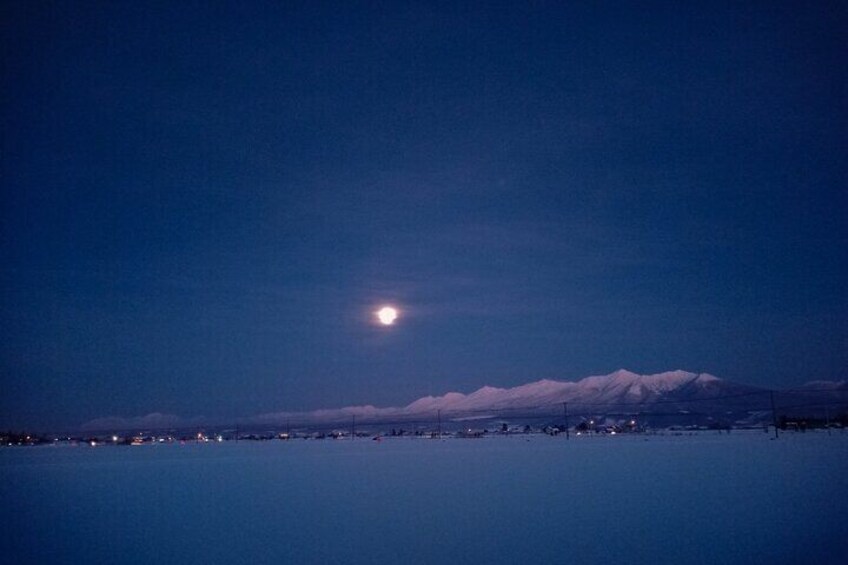 Bask in the Glow of the Moonlit Furano: A Tranquil Winter Night Awaits