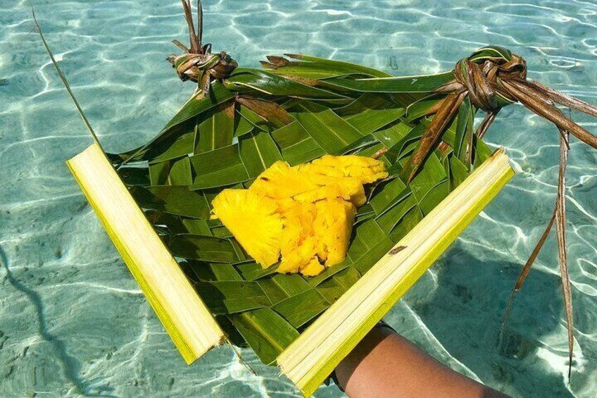 Tasting of local fruits feet in the water