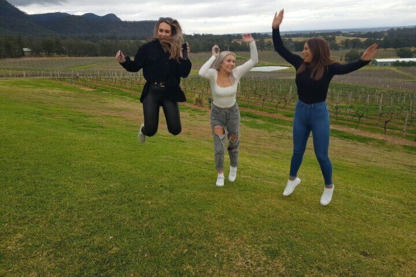 Jumping for joy on tour in the vineyards