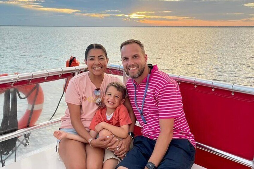 Family of cruisers on SunVenture enjoying the sunset while on the dolphin cruise. 