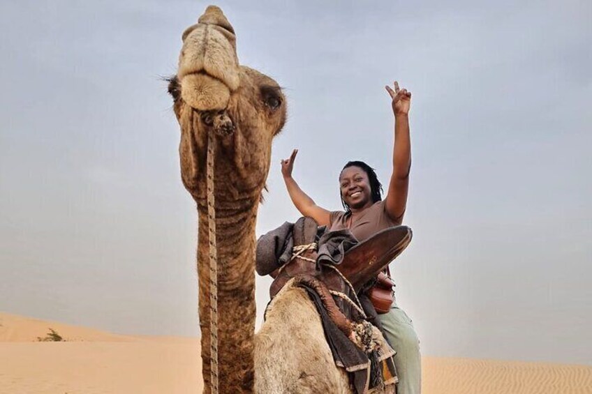 Riding camel in the desert of Lompoul 