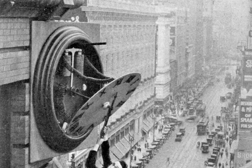 Safety Last! (1923), a silent comedy starring Harold Lloyd, features iconic stunts, including the famous scene of Lloyd hanging from a skyscraper.