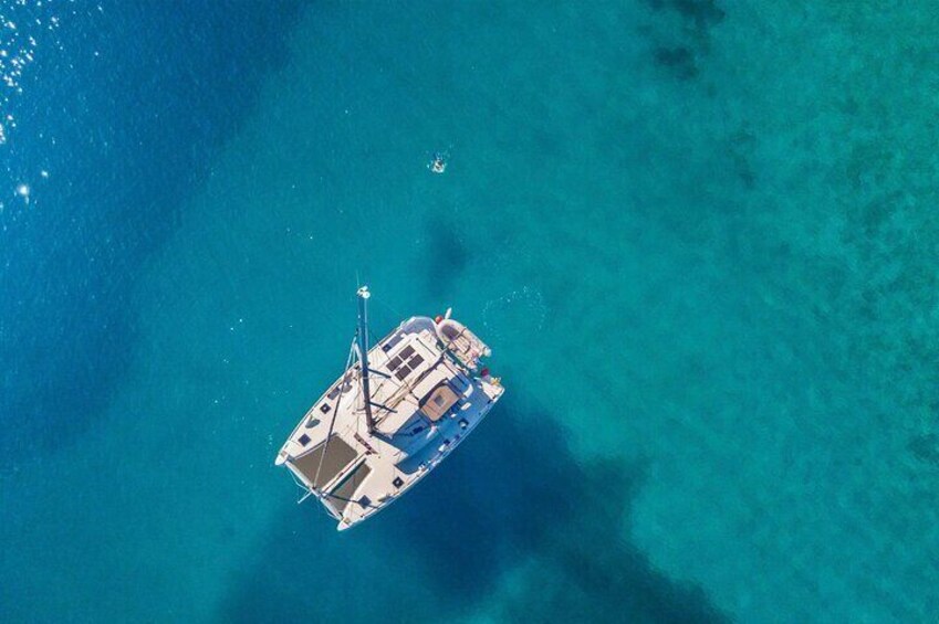 Mykonos Private Catamaran Cruise: BBQ & Drinks (Pick-up Included)