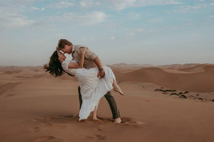 Celebrate love in the stunning Swakopmund dunes – the perfect backdrop for this magical engagement moment.