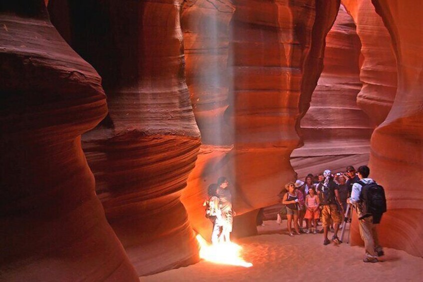 Antelope Canyon in Arizona is a famous slot canyon known for its stunning light beams and vibrant red rock formations, making it a popular photography destination.