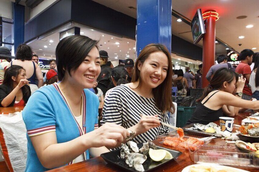 Enjoying Oysters and Sushimi at the Fish Market Credit James Horan; Destination NSW