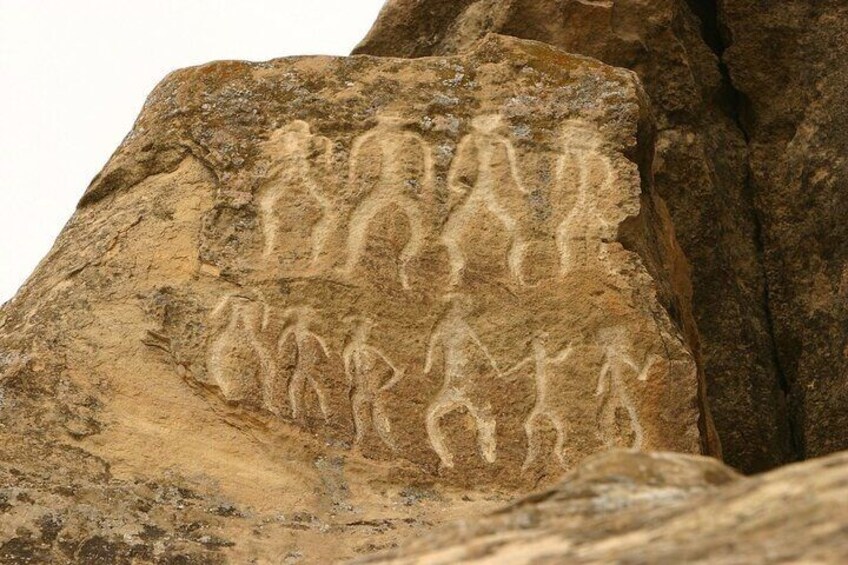 Step back in time at Gobustan — where stories from over 10,000 years ago are carved into stone.