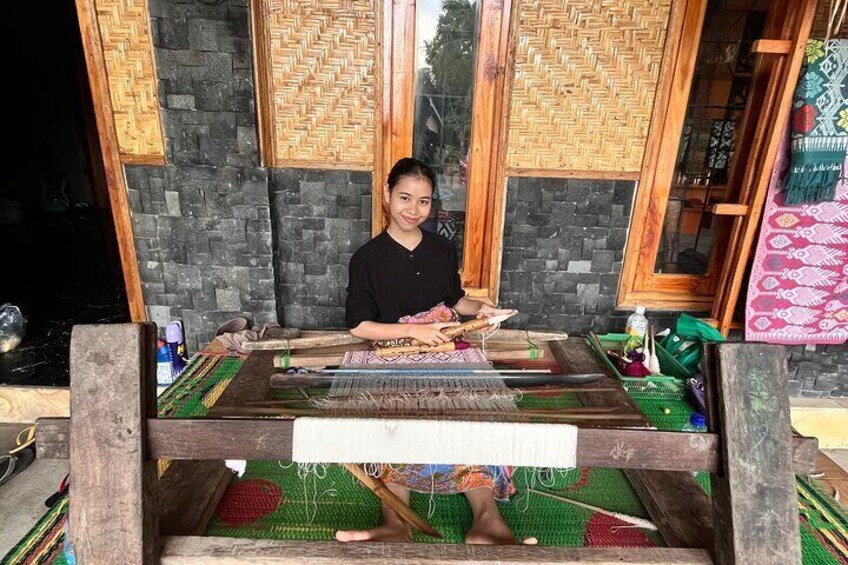 Local people make weaving sarung 