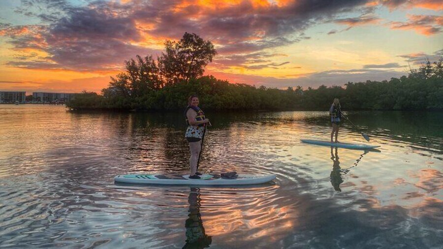First timers enjoying a colorful sunrise in Jupiter