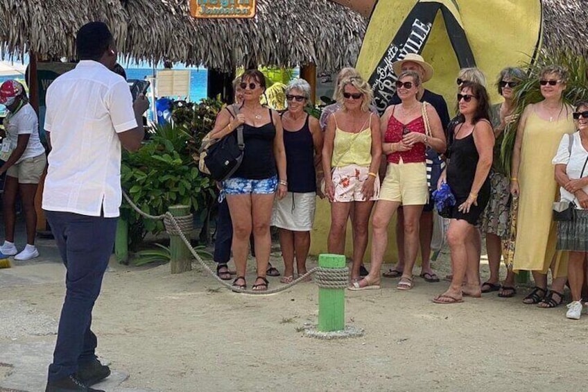 Our driver / tour expert snapping pictures of guests at Margaritaville in Negril.