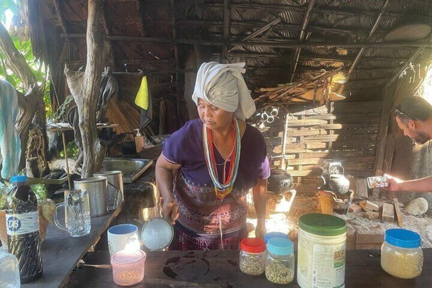 White Karen tribe woman making coffee
