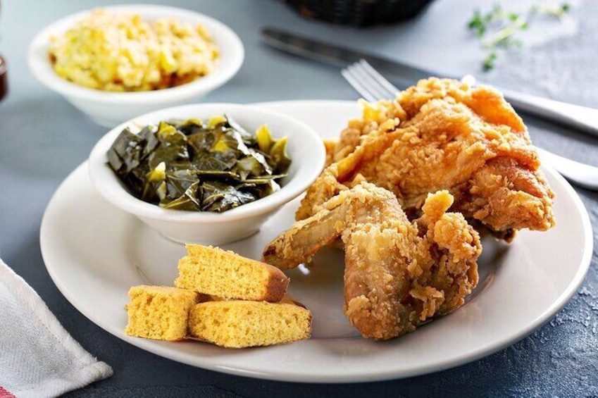 Shared Soul Food Sampler: Hardy collard greens, ooey gooey mac & cheese, candied yams, catfish with tar
tar sauce, BBQ rib, fried chicken, Grandma's hot water cornbread!!!